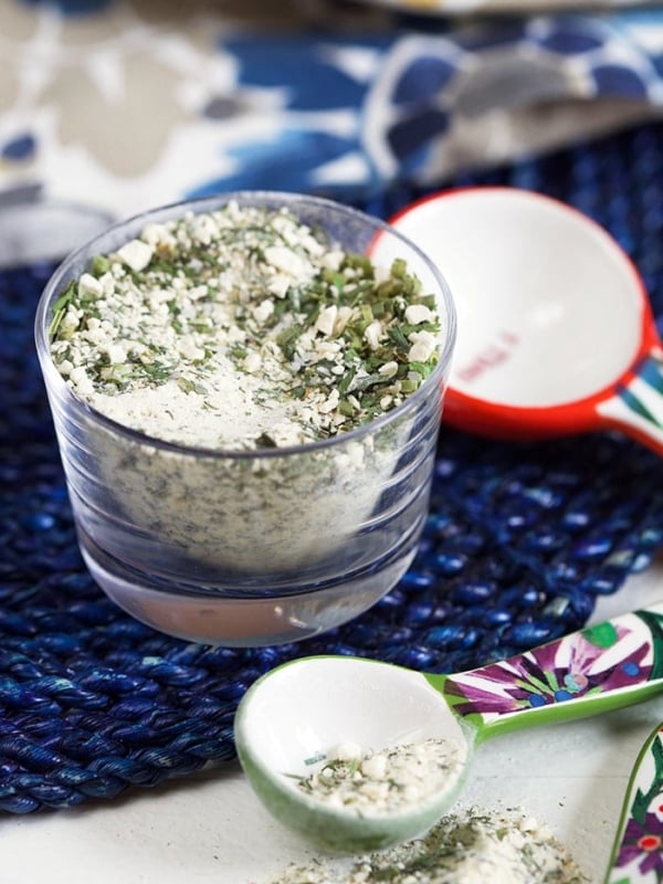 Ranch Seasoning in a glass dish on a blue placemat.