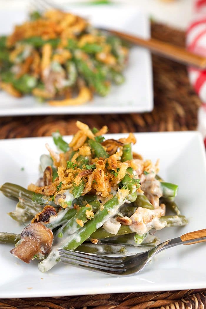 Green bean casserole on a white square plate.