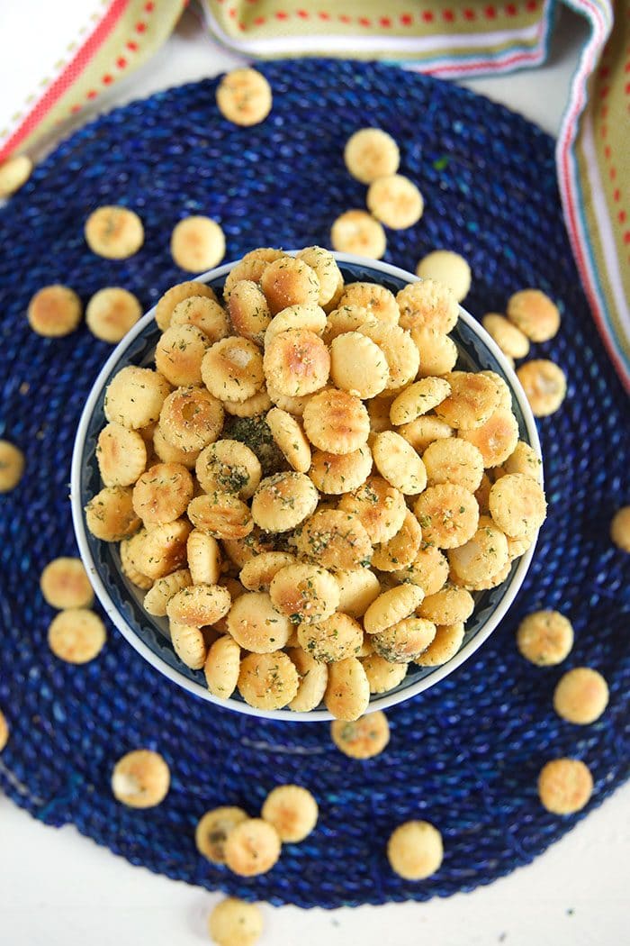 Ranch Oyster crackers in a bowl on a blue placemat.