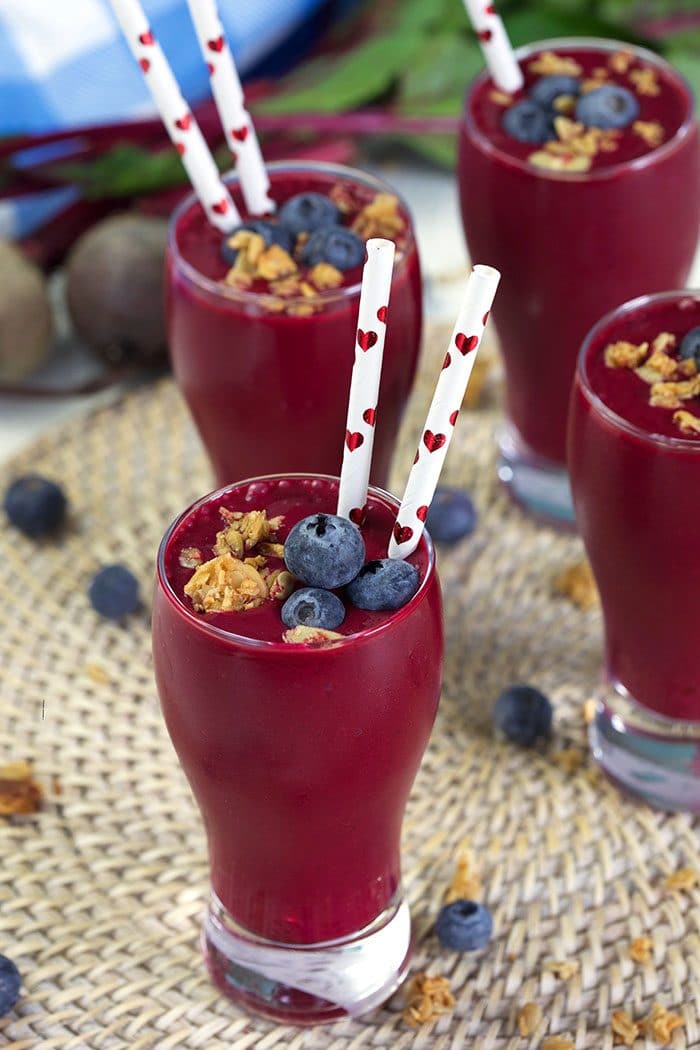 Berry Beet Smoothies on a wicker background.