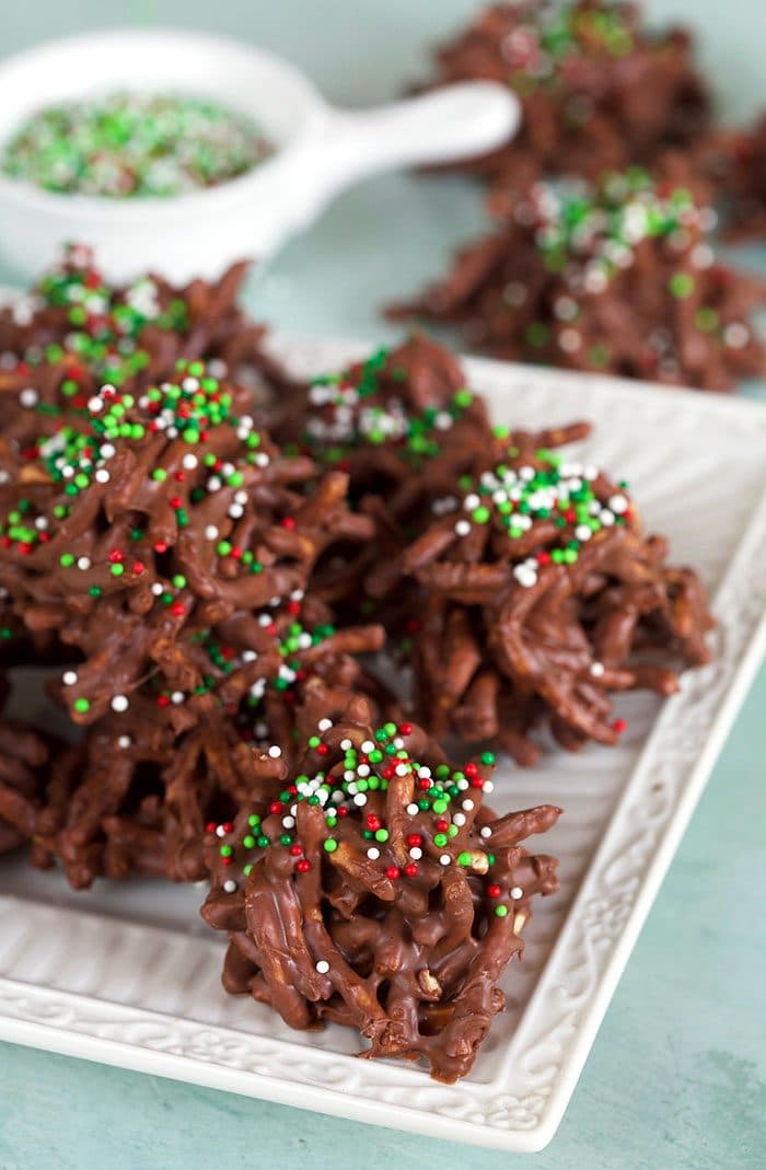 Chocolate haystack cookies on a white square plate.
