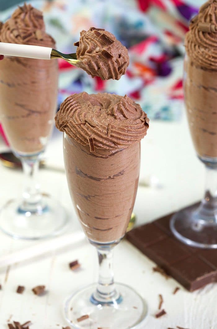 Chocolate mousse being scooped with a spoon.