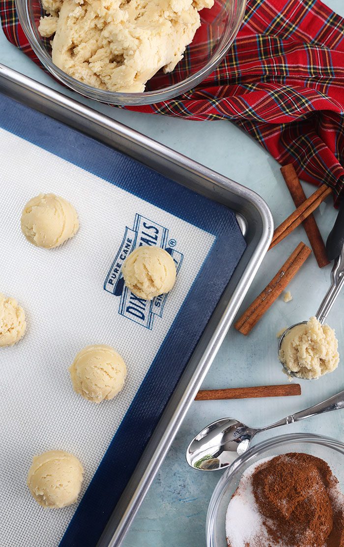 Snickerdoodle cookie dough on a baking sheet.