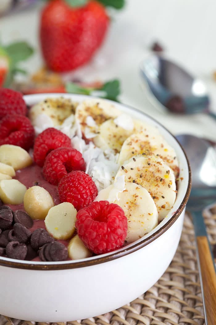 Acai bowl with banana, chia seeds and raspberries.