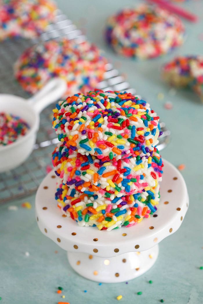 Funfetti cookies on a cake stand.