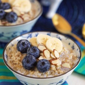 Steel Cut Oatmeal in a bowl with blueberries, bananas and almonds.