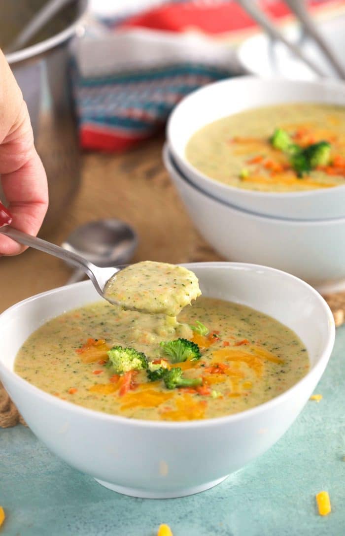Broccoli Cheddar Soup with a spoon scooping some out of a bowl.