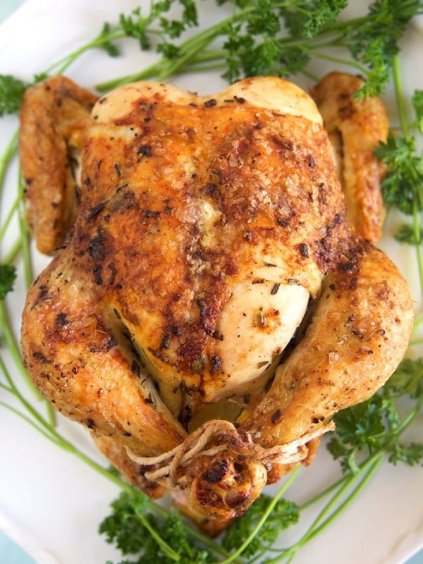 Overhead shot of Oven Roasted Chicken on a white platter.