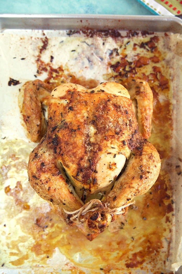 Oven roasted chicken on a baking sheet.