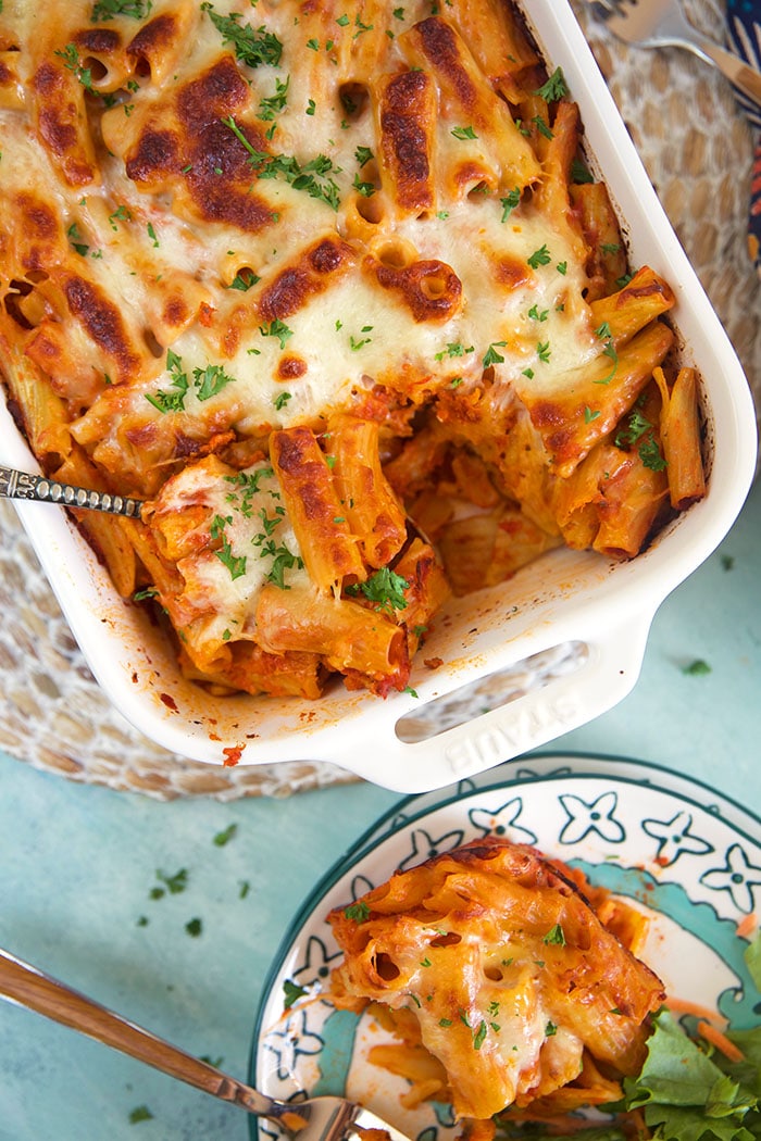overhead shot of baked rigatoni in a white baking dish.
