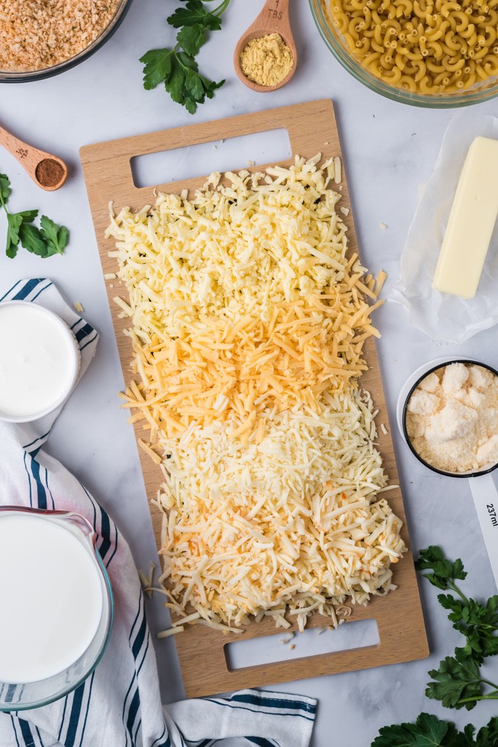 Grated cheese on a wood board.