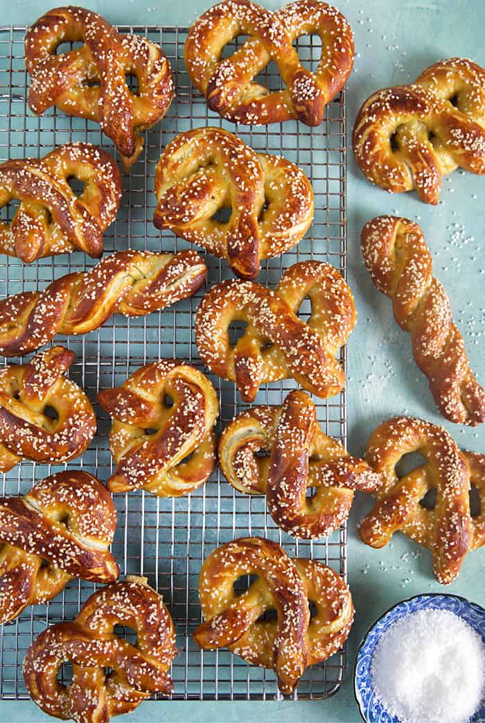 Overhead shot of homemade pretzels on a baking rack.