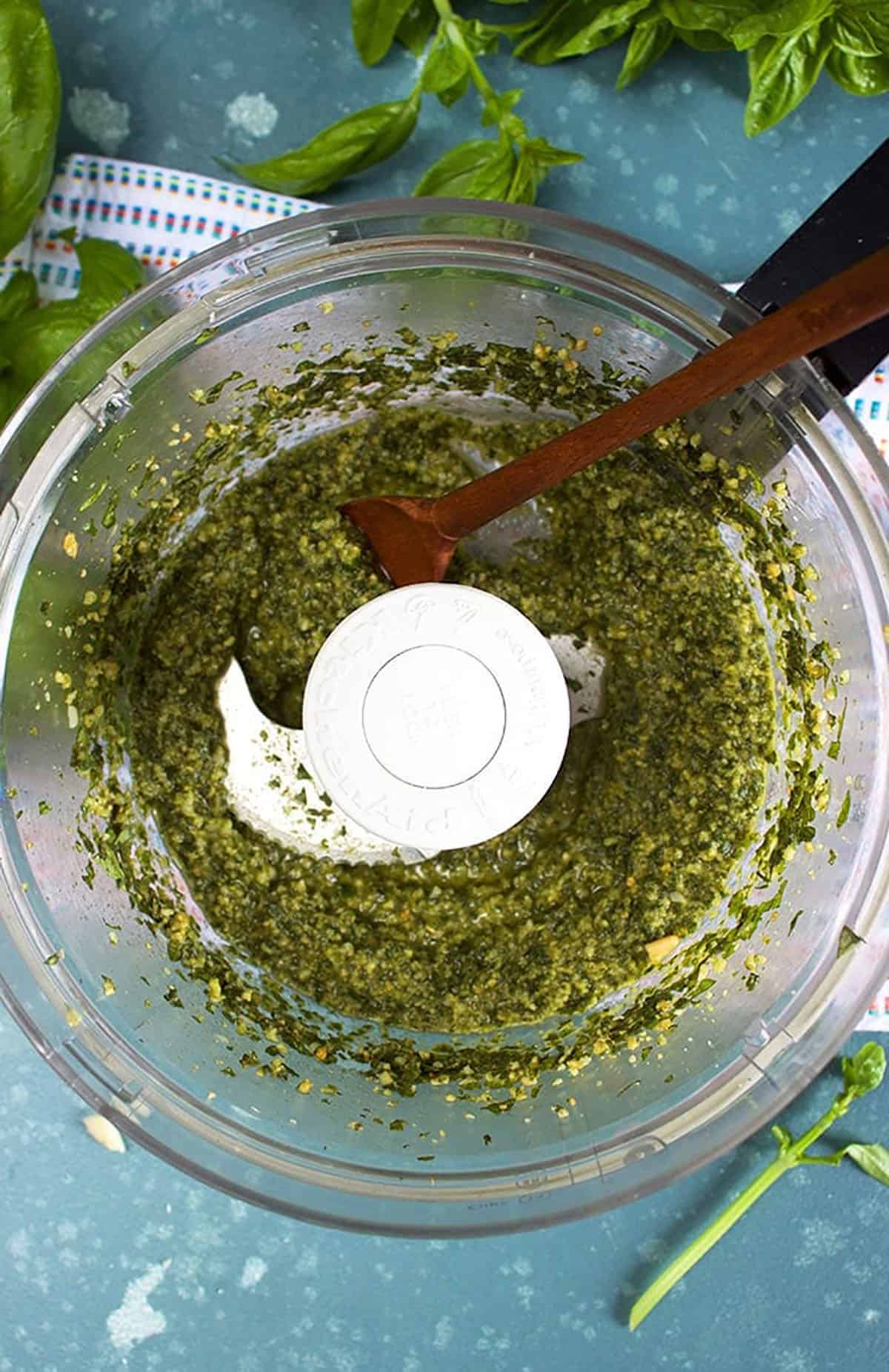 Basil Pesto in the bowl of a food processor 