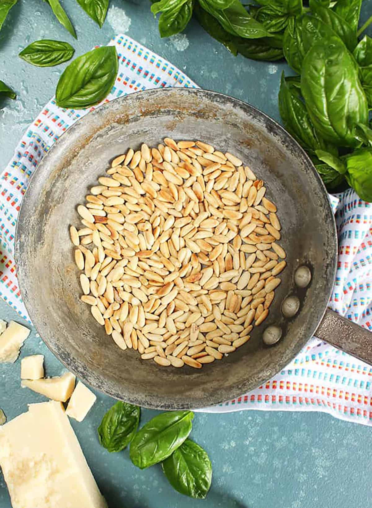 Toasted Pine Nuts in a skillet for the Very Best Basil Pesto