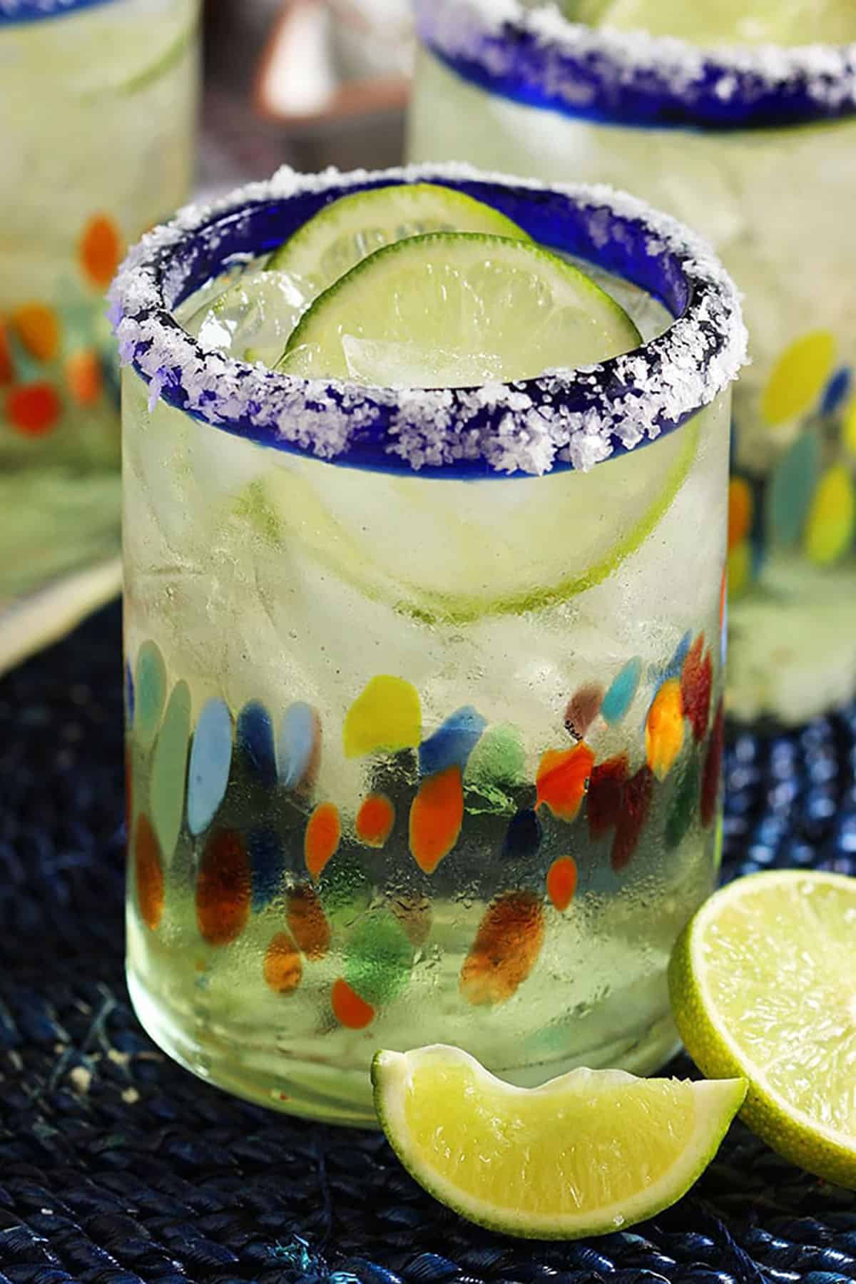 Margarita with a salt rim and slices of lime floating on top