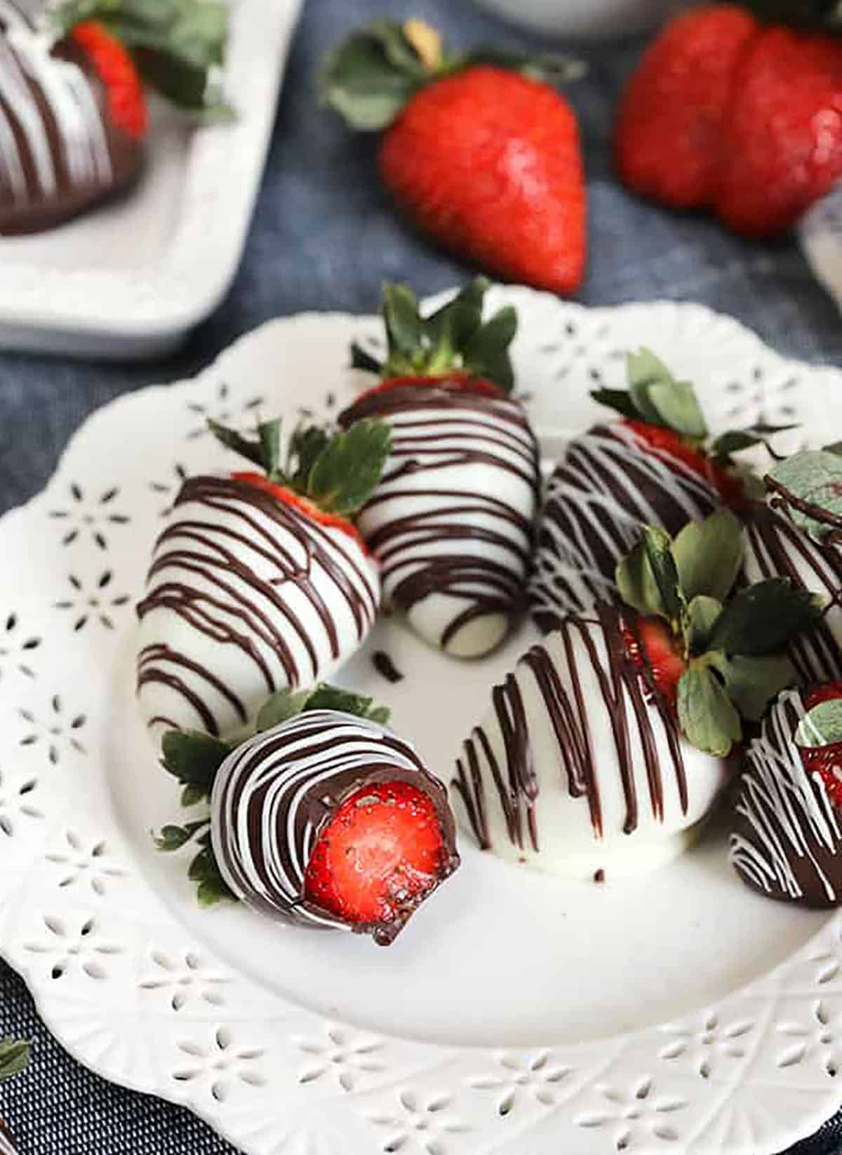 Chocolate dipped strawberries on a white plate