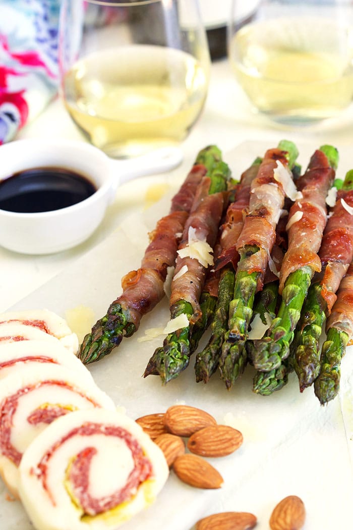 small charcuterie board with prosciutto wrapped asparagus