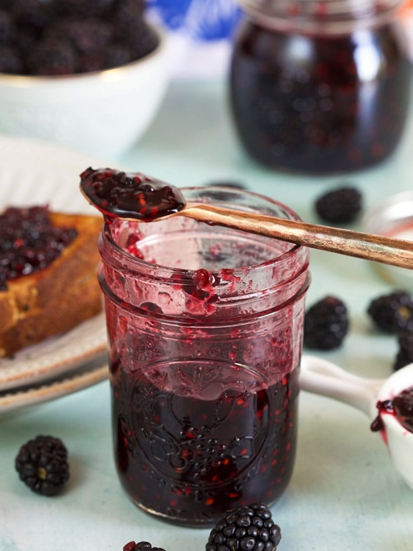 A spoon is placed on top of a jam jar.