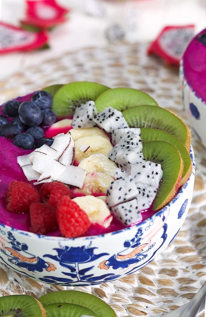 Close up of Pitaya smoothie bowl with fresh fruit on top.