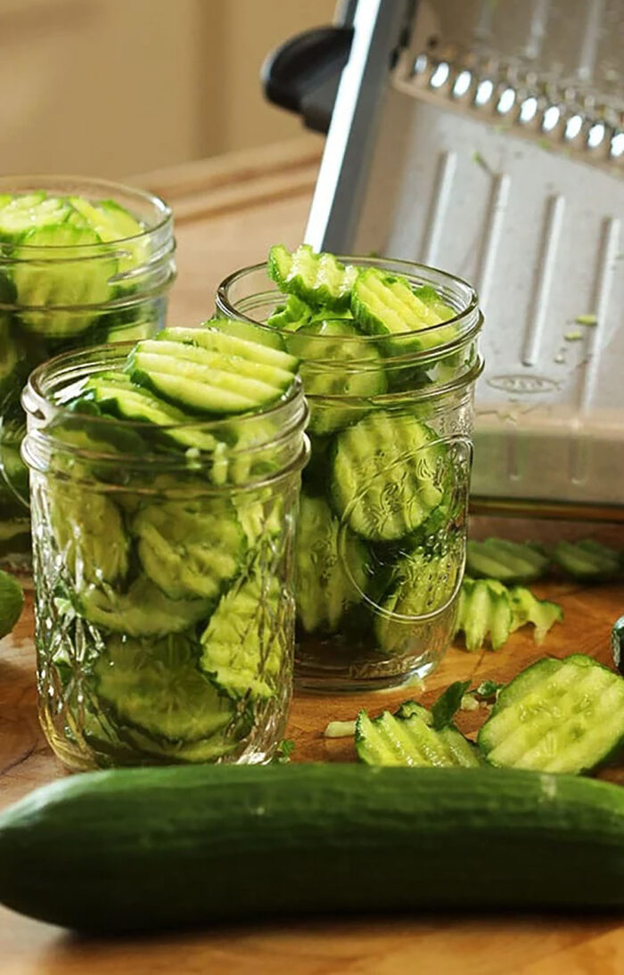 sliced cucumbers in a jar for pickles.