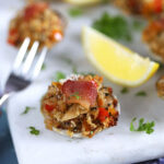 Close up of clams casino on a marble platter