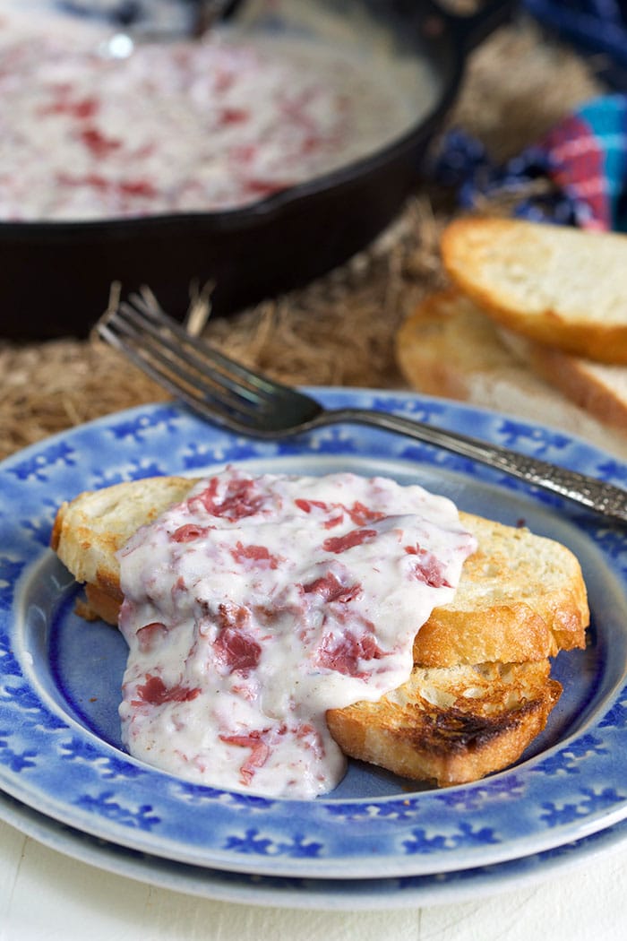Creamed Chipped Beef on toast on a blue plate.