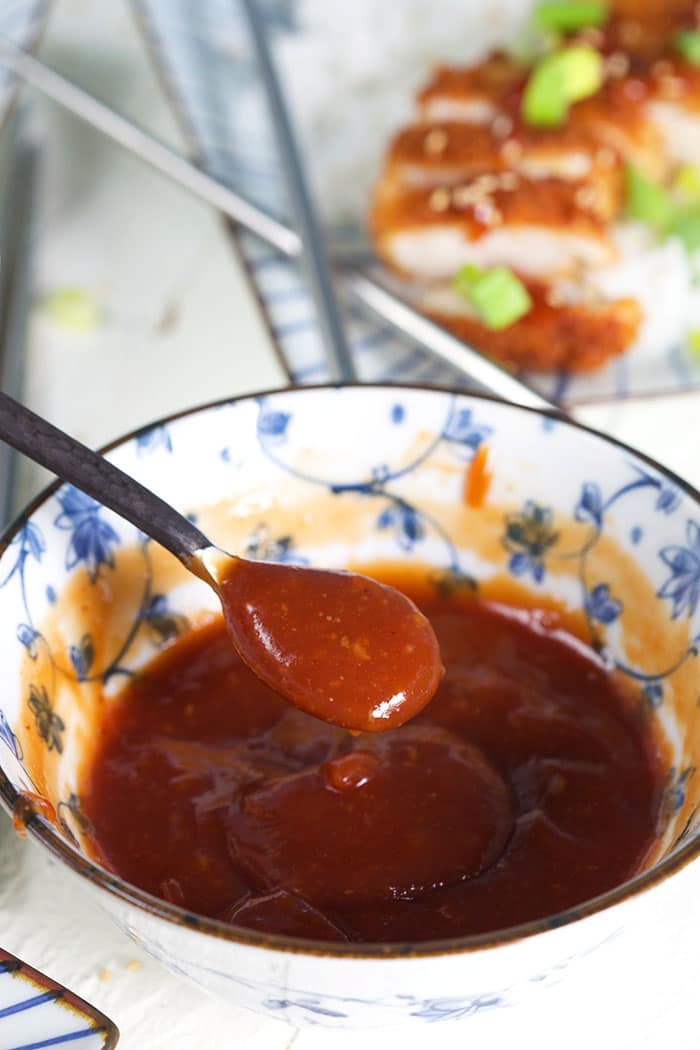 Tonkatsu Sauce being served with a spoon.