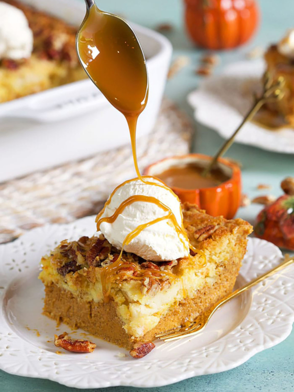 Pumpkin Crunch Cake being drizzled with caramel sauce.