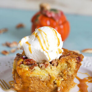 Pumpkin crunch cake with whipped cream on top.