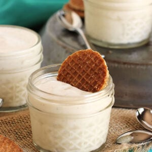 jar of vanilla pudding with a mini stroopwafel stuck in the top