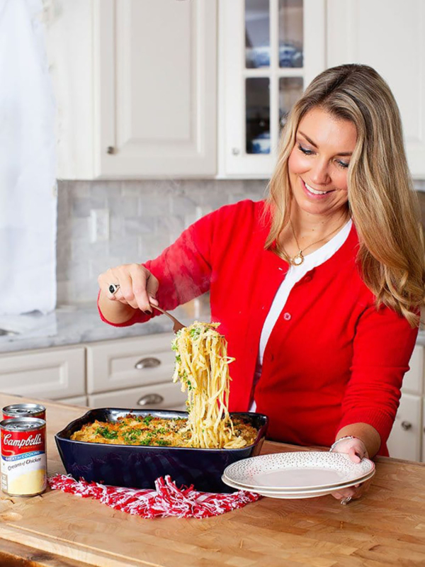 Pasta being served from a baking dish.