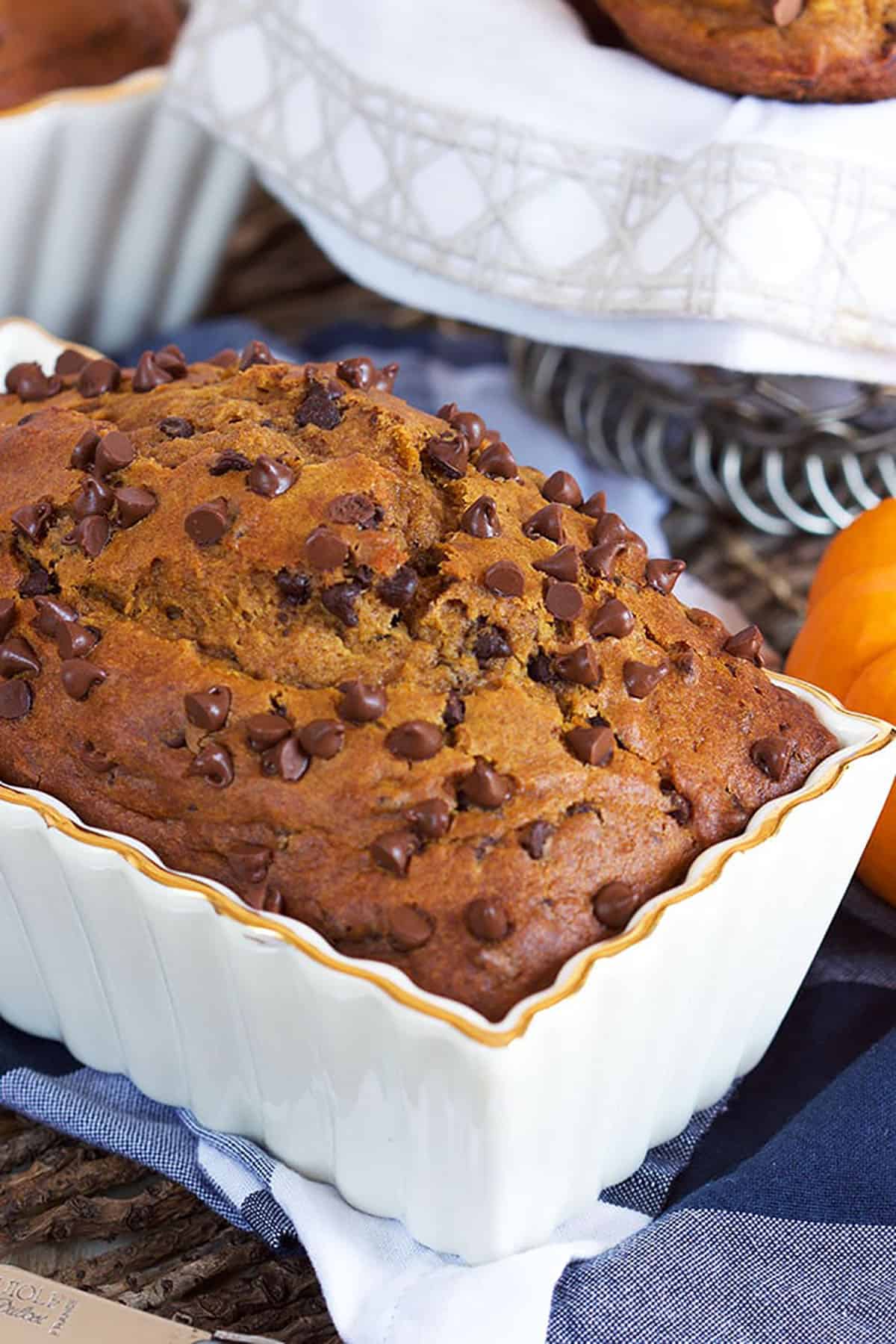 Chocolate chip Pumpkin Bread in a white loaf pan.
