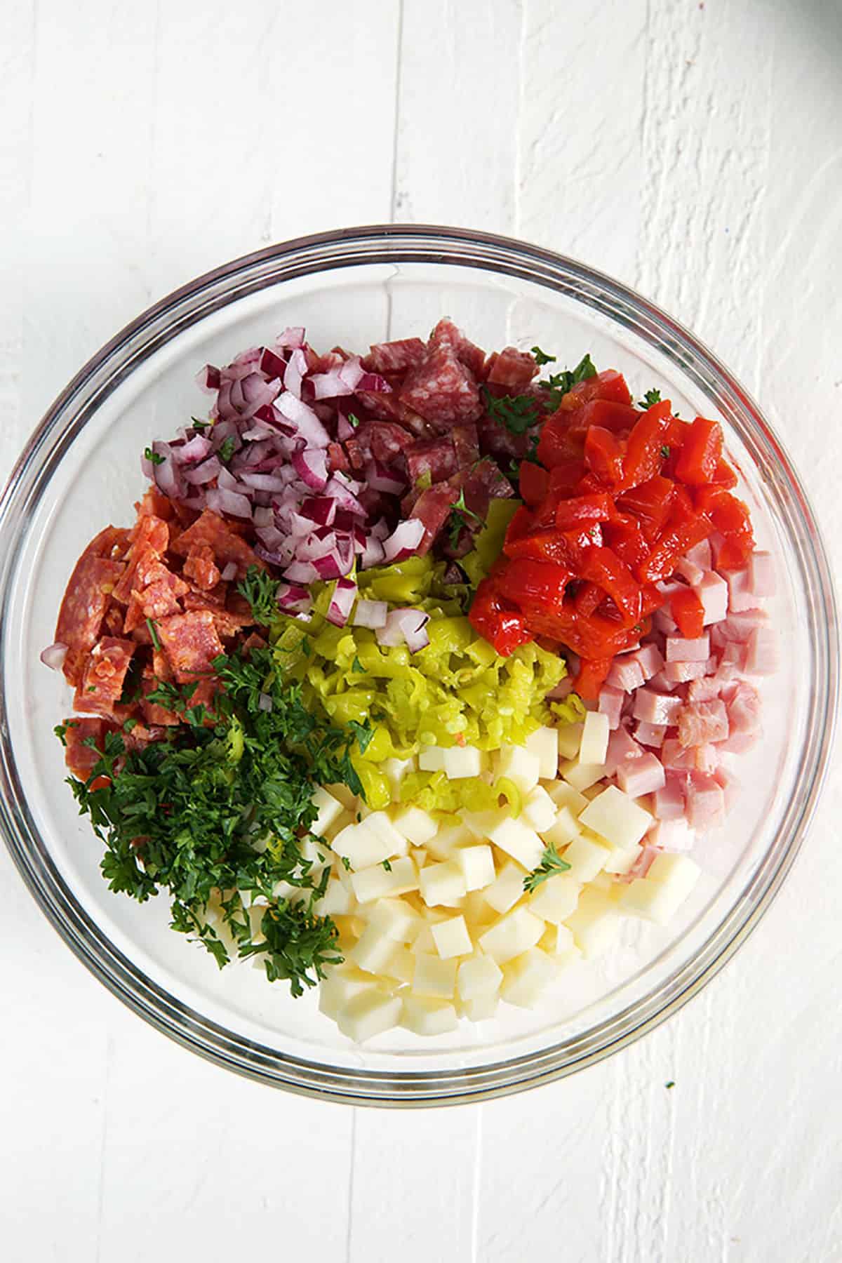 Ingredients for hoagie dip in a mixing bowl