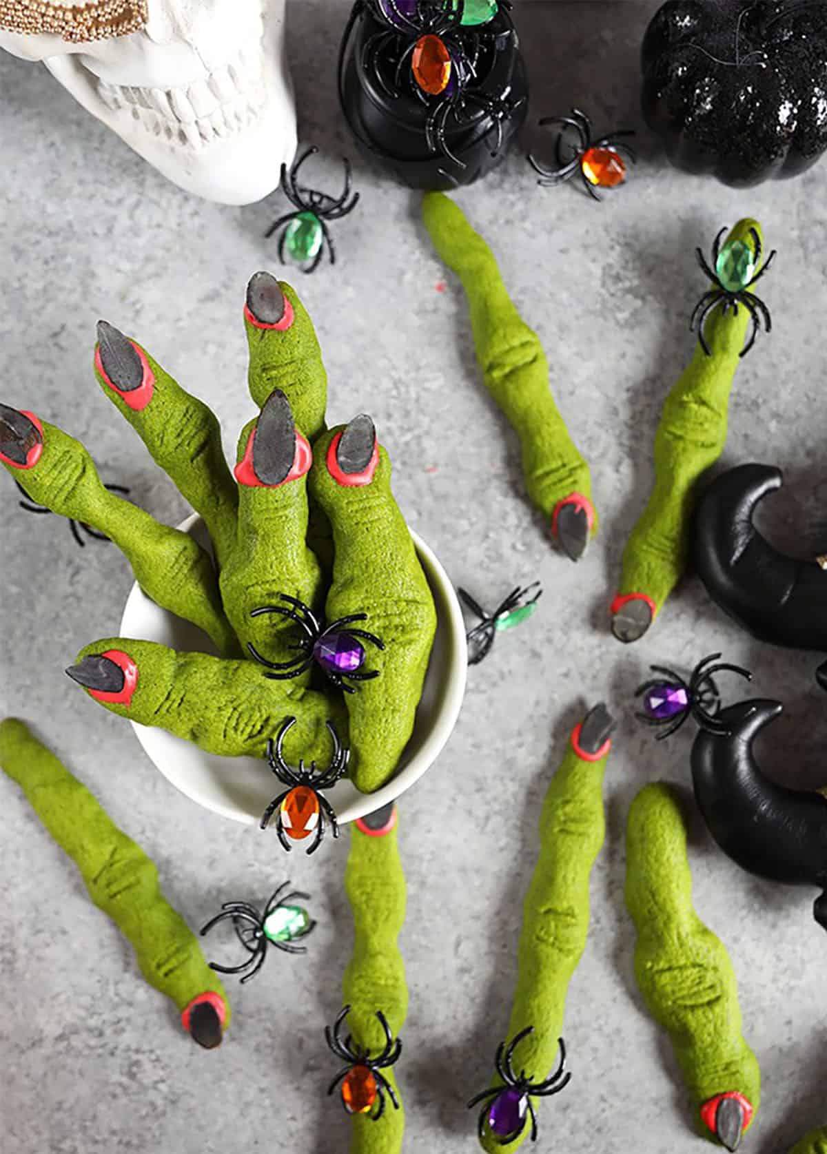 Witch Finger Cookies in a bowl and on a gray background.