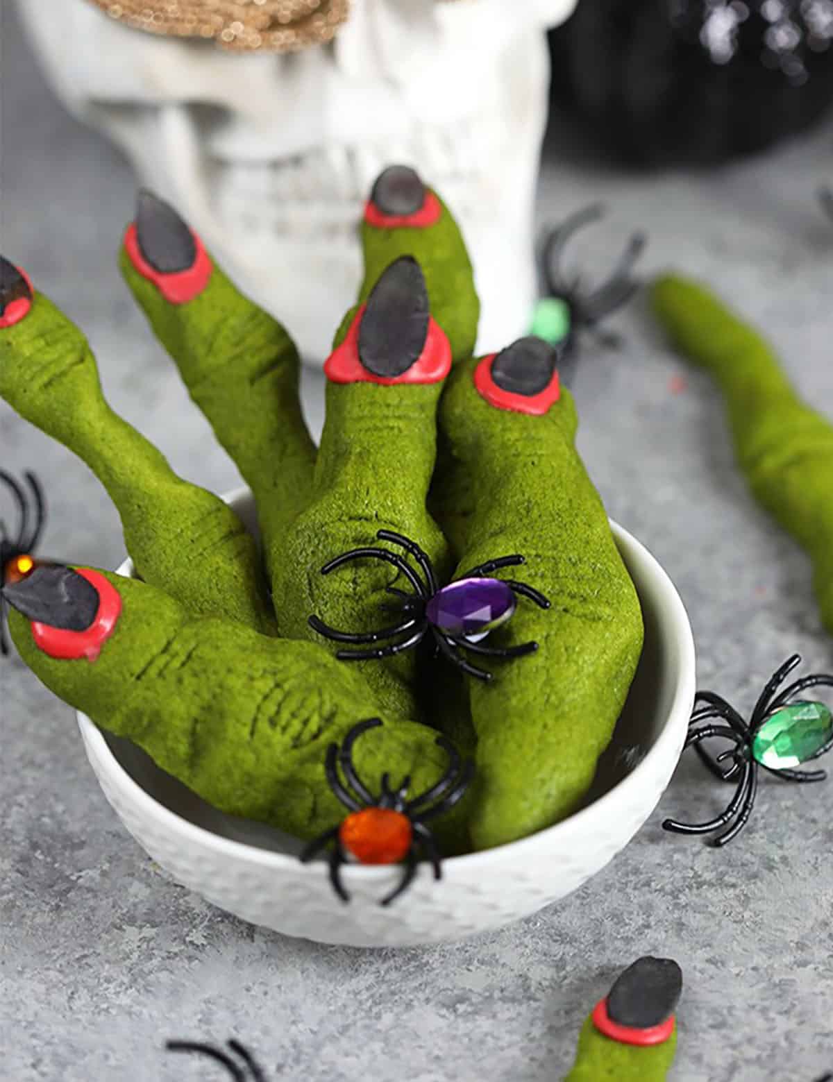 Witch finger cookies in a white bowl.