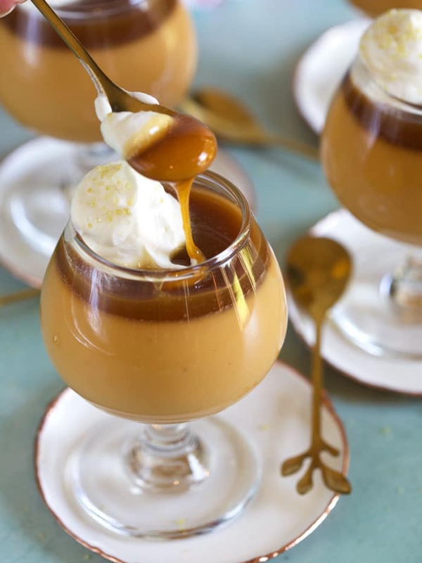 Butterscotch Pot de Creme with a spoon scooping out a bite.