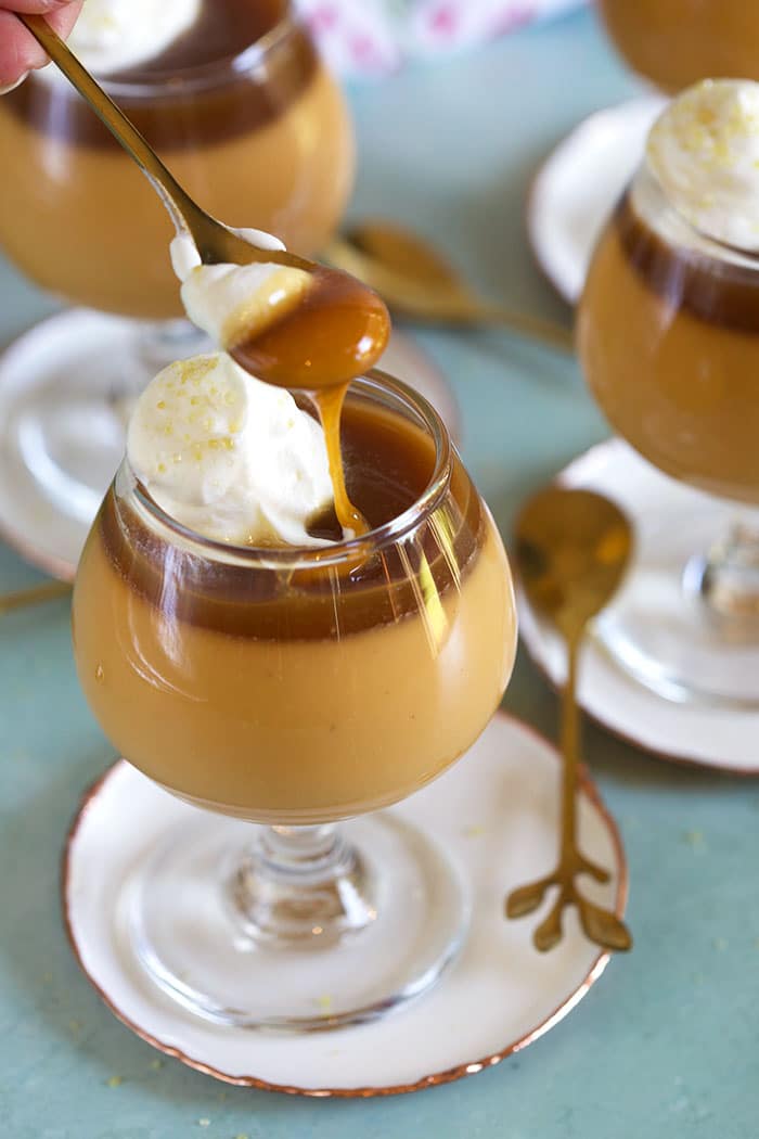 Butterscotch Pot de Creme with a spoon scooping out a bite.