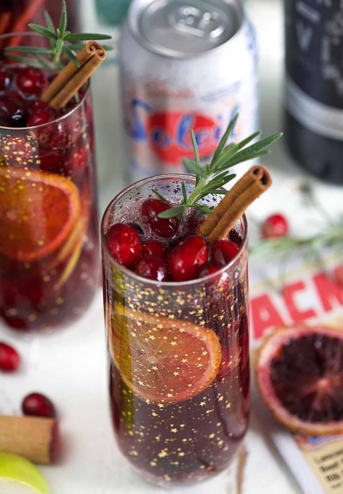 Christmas Sangria on an ACME flyer with a can of sparking water in the background.