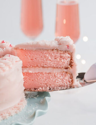 Slice of Pink Champagne Cake being served.