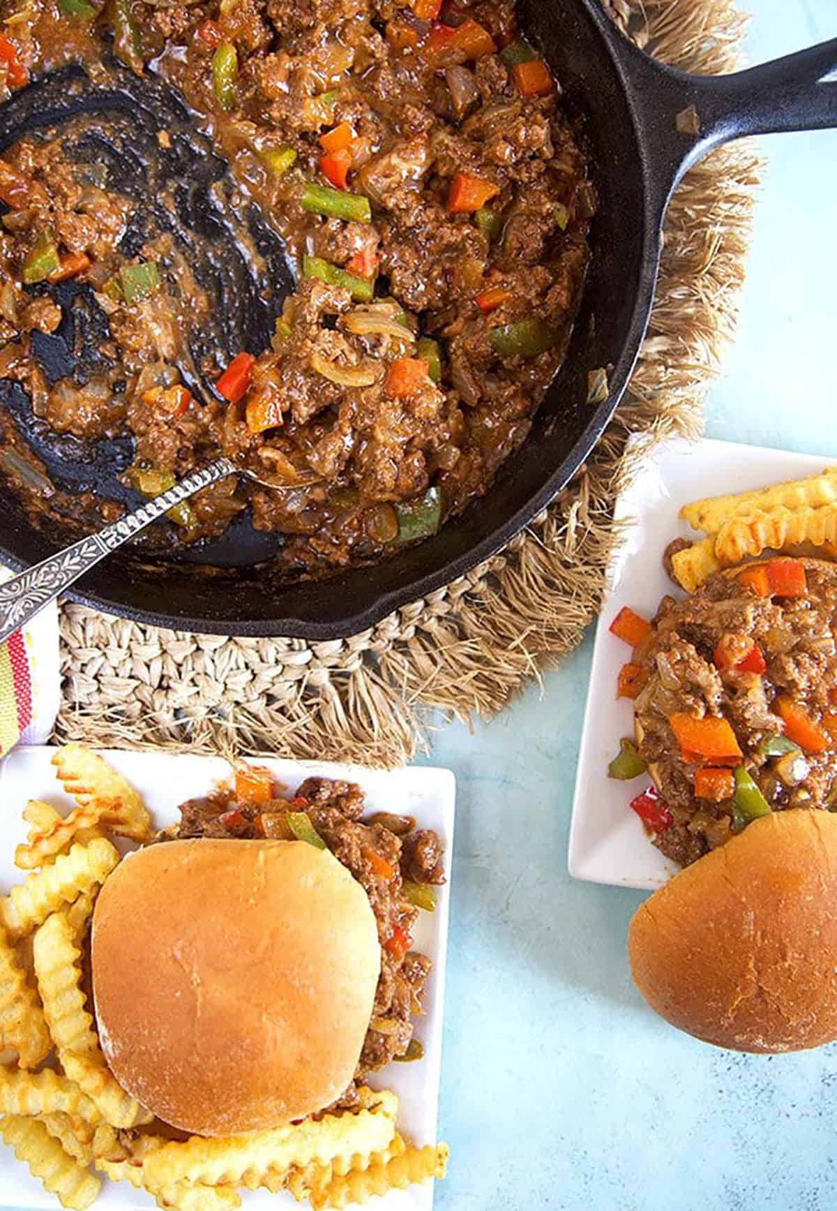 Overhead shot of philly cheesesteak sloppy joes on a plate