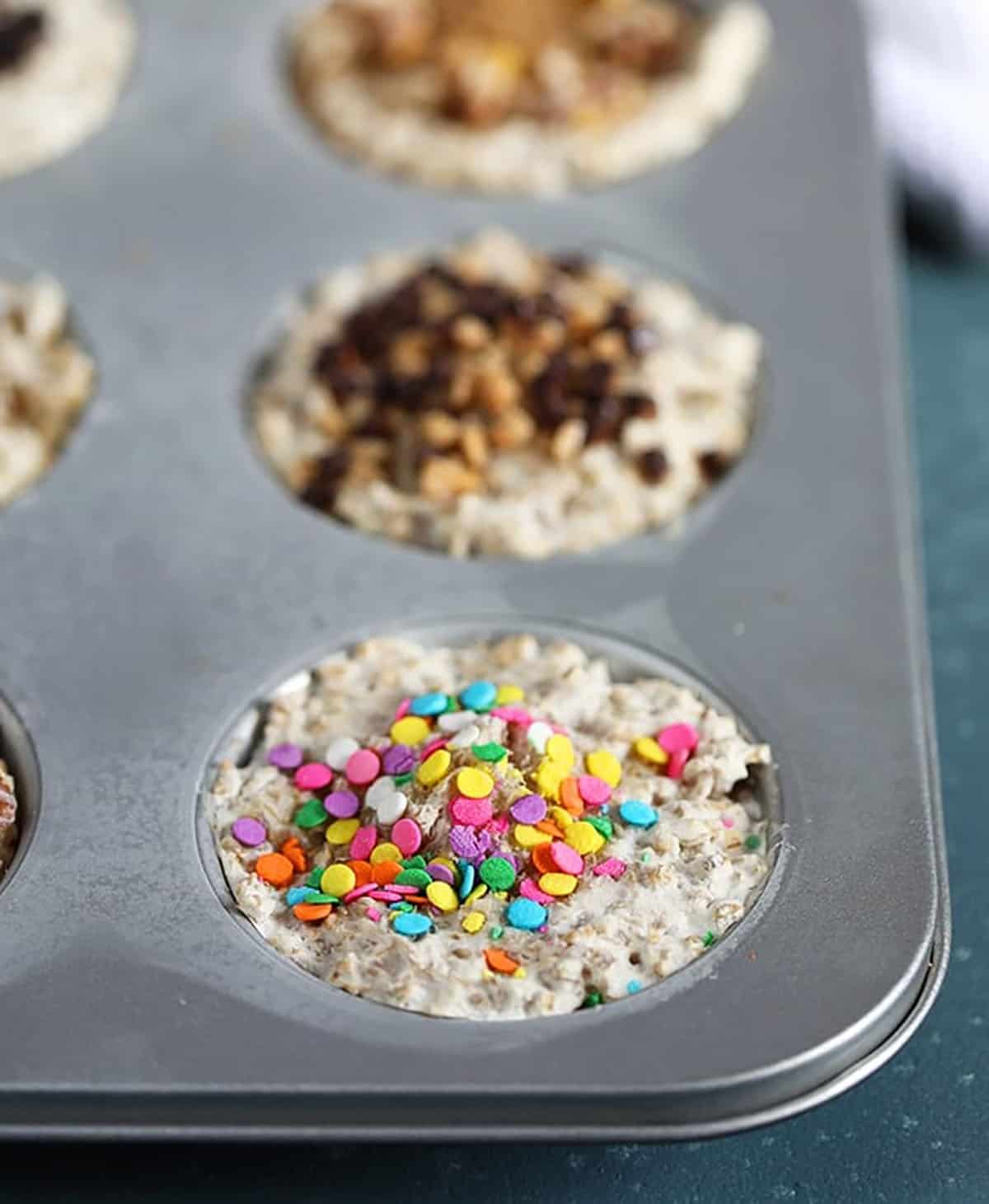 Oatmeal in muffin tin with a variety of toppings