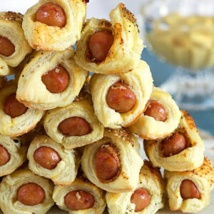 Close up of Pigs in a Blanket in a pyramid shape.