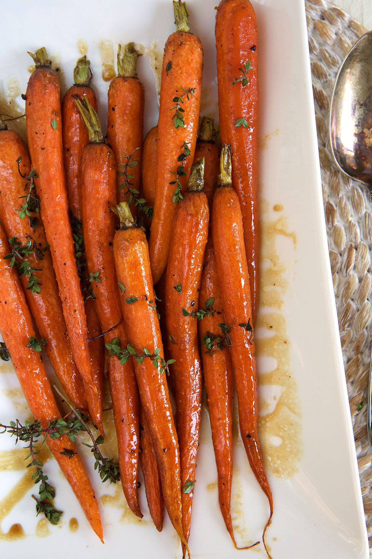 Baked carrots are placed on a serving platter.