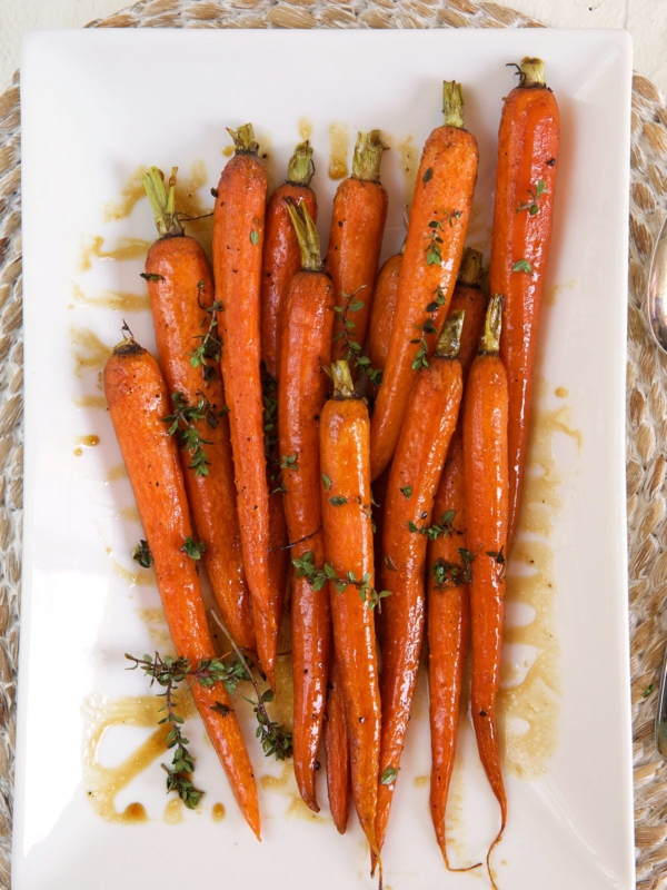 Carrots are placed in the center of a white plate.