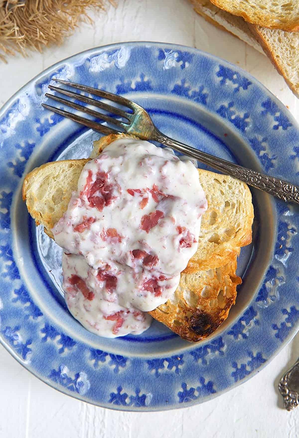 Creamed Chipped Beef on toast on a blue plate.