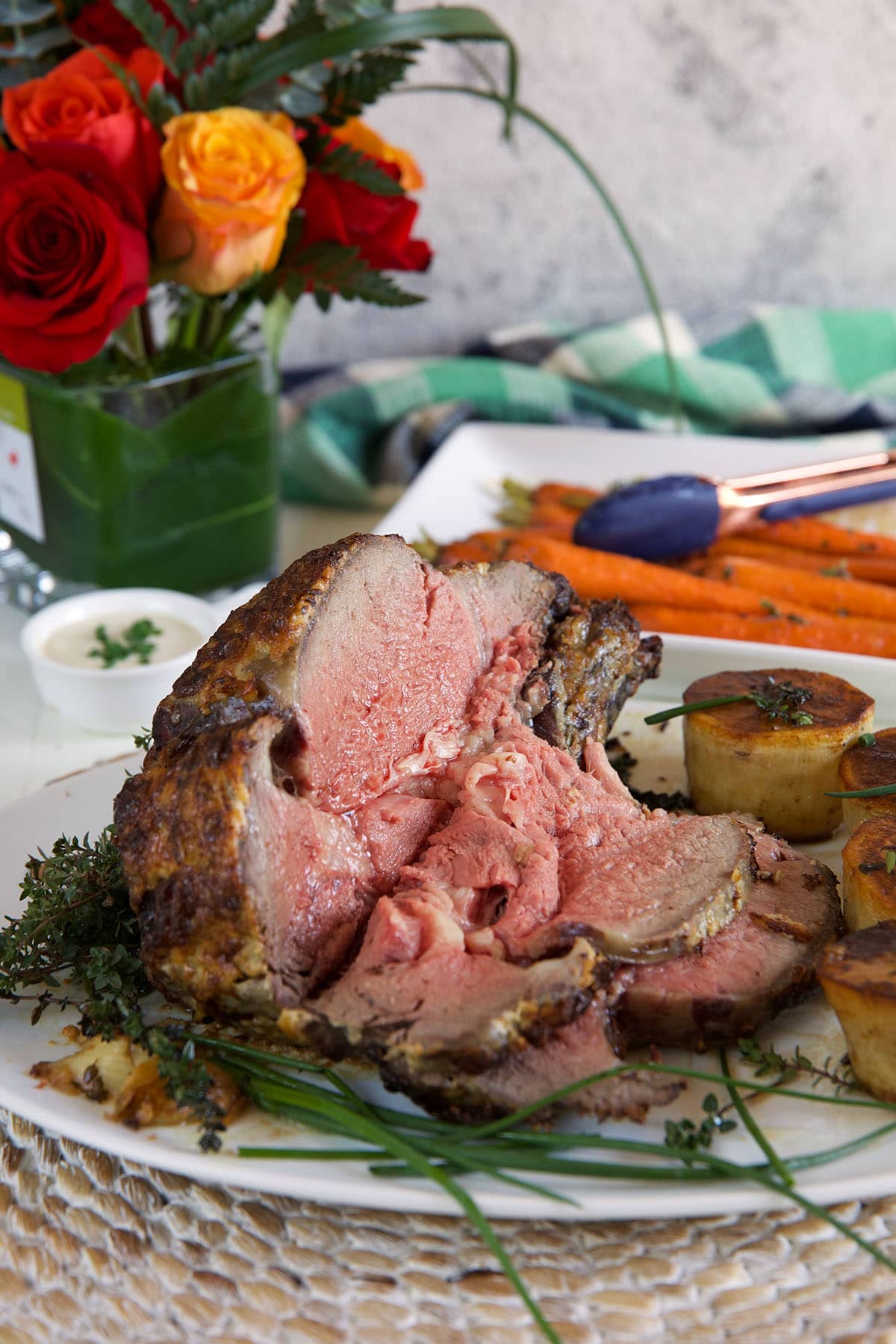 A sliced prime rib roast is ready to be served. 