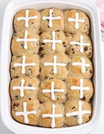 Hot Cross Buns baked in a white baking dish.