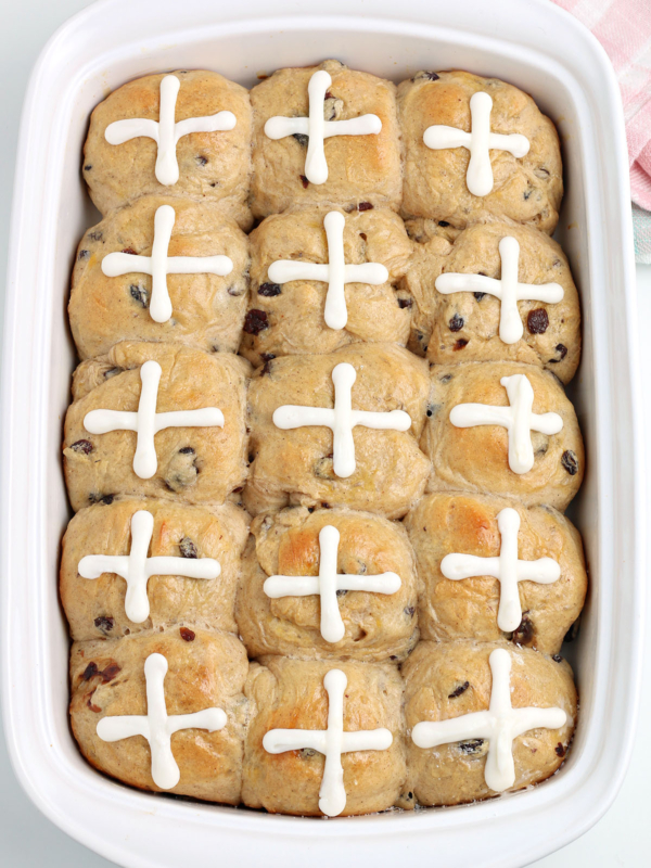 Hot Cross Buns baked in a white baking dish.