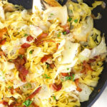 Close up of polish haluski in a black skillet.