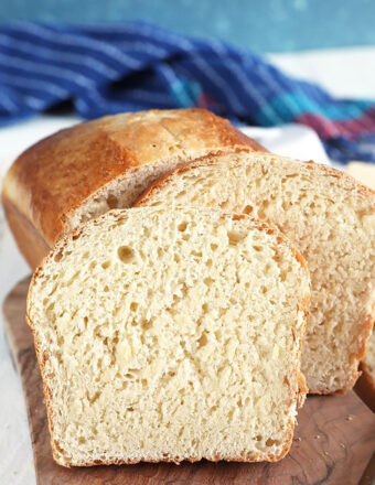 Homemade white bread on a wood bread board.